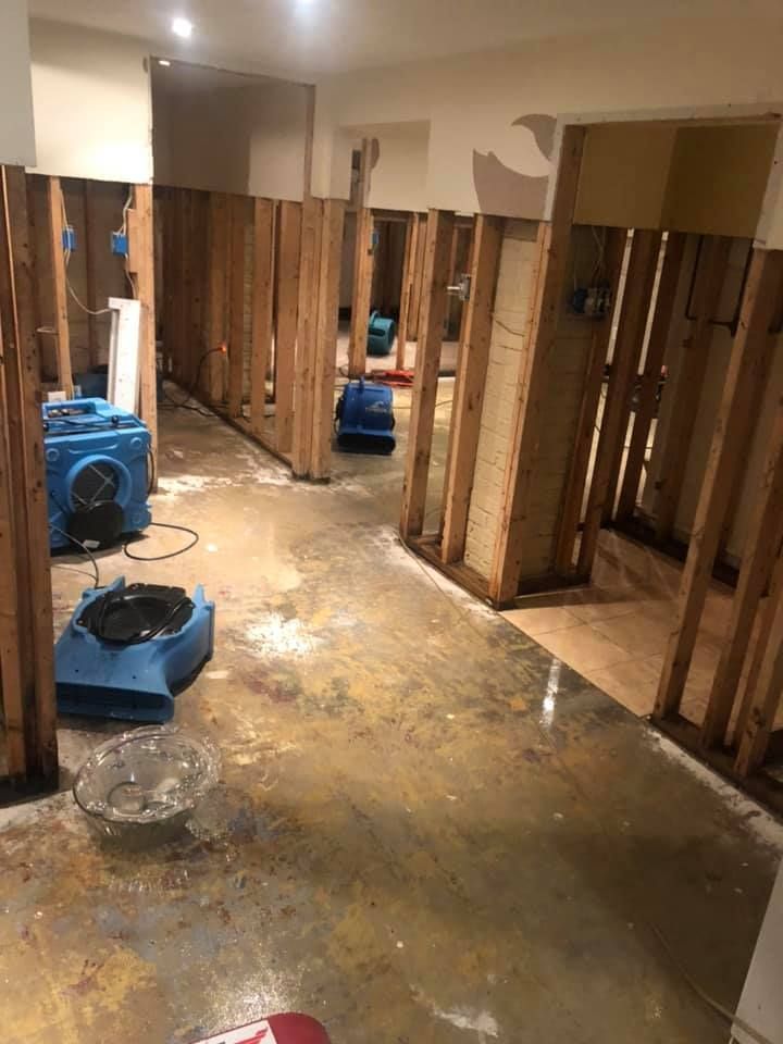 A room under renovation with exposed wooden wall studs