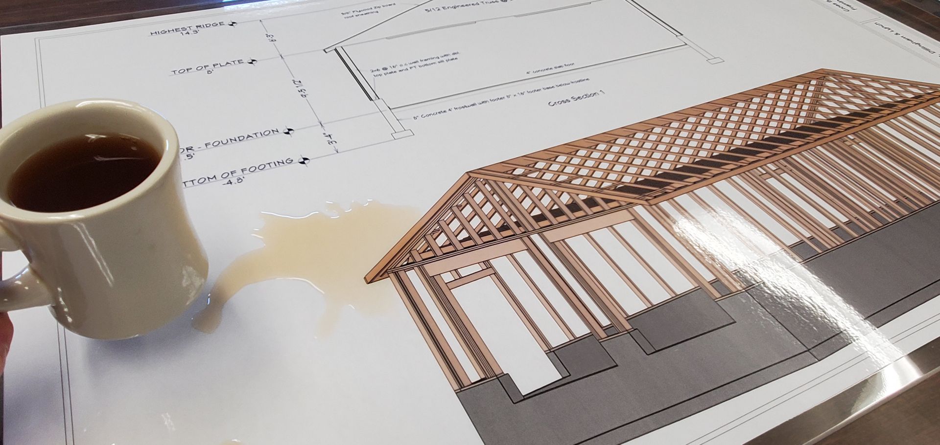 Coffee spills on architectural blueprints.