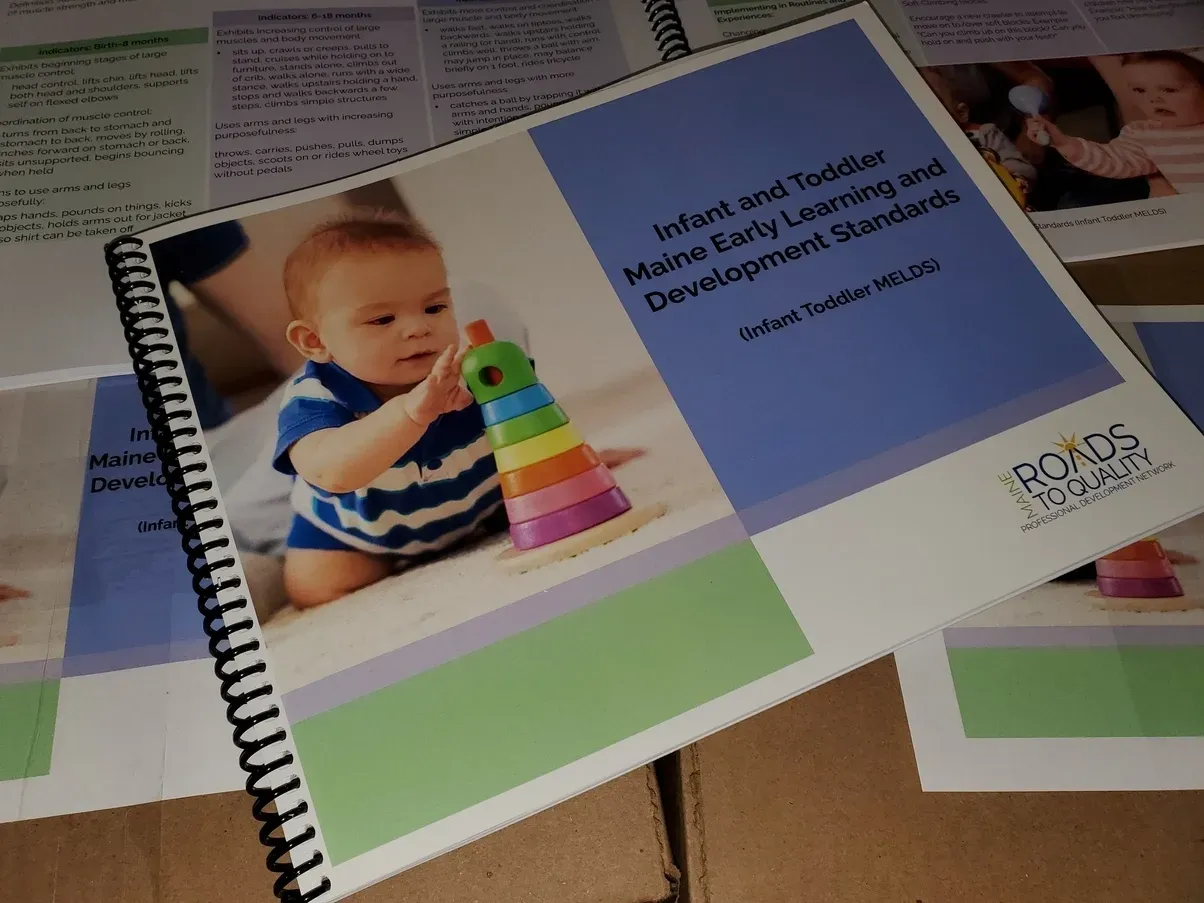 Booklet with a baby on the cover, titled