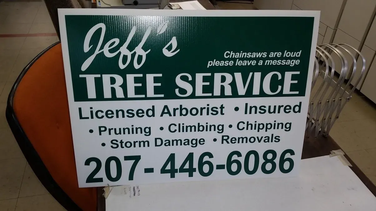 Sign for Jeff's Tree Service: green and white, lists services and phone number 207-446-6086.