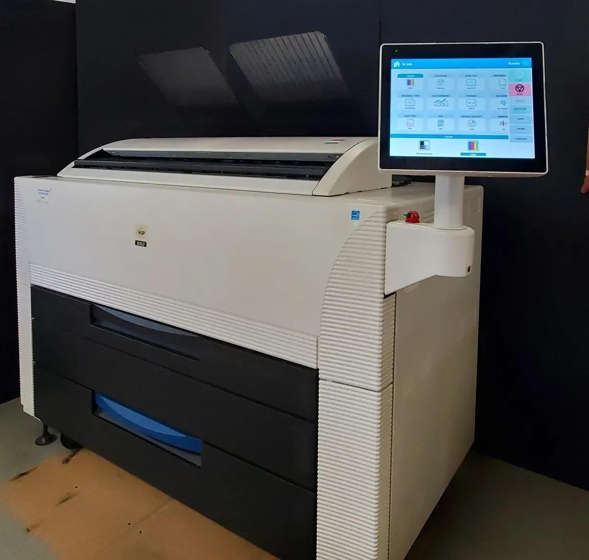 Large format white and black printer with a touchscreen control panel.