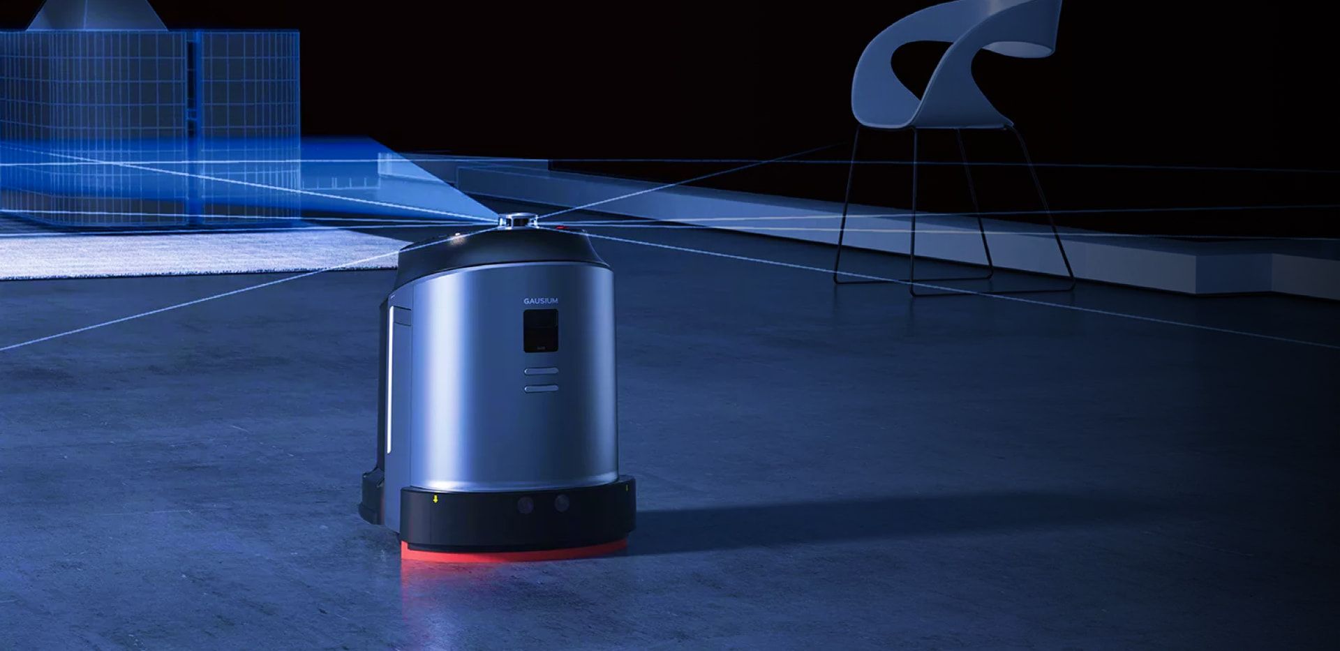A robot is standing on a concrete floor in a dark room.