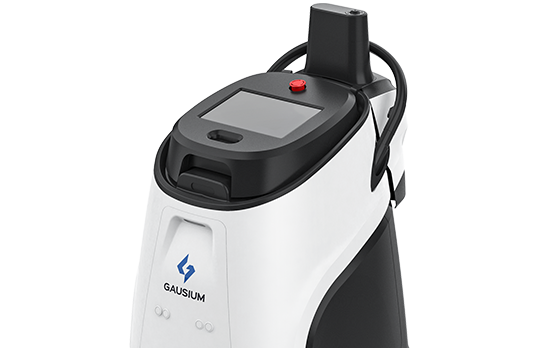 A white and black machine with a red button on top of it.