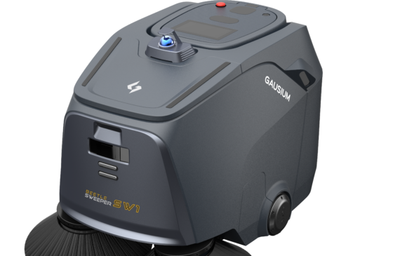 A white robot is cleaning the floor in a room.