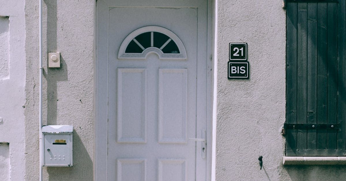 The front door of a house with a mailbox in front of it.