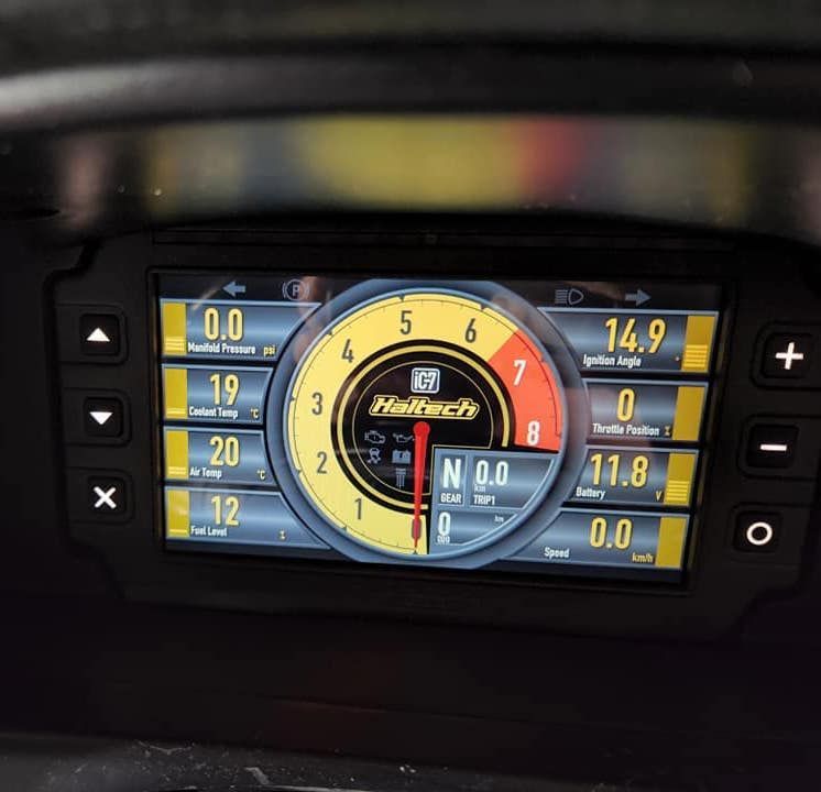 A Bunch of Wires Are Laying on The Ground Next to A Wheel  — Genesis Automotive Services in Lavington, NSW