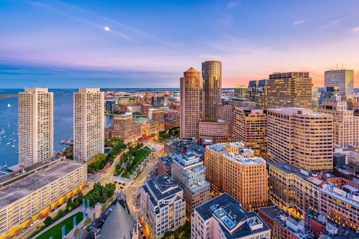 tall buildings next to a body of water