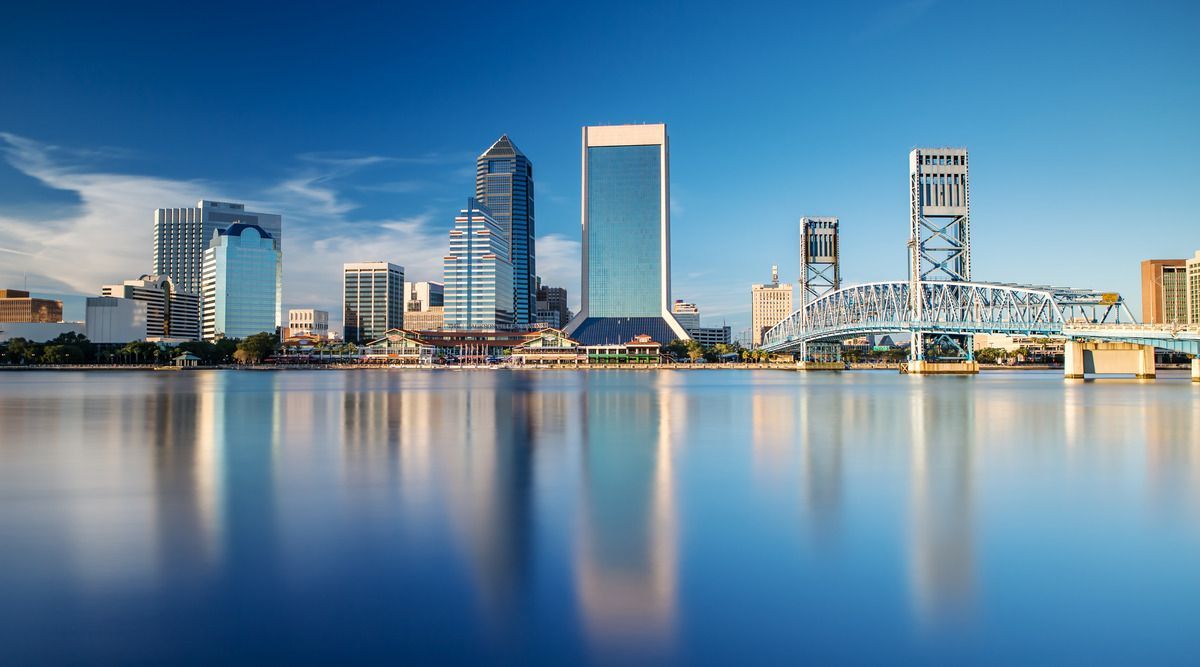 skyscrapers next to a body of water
