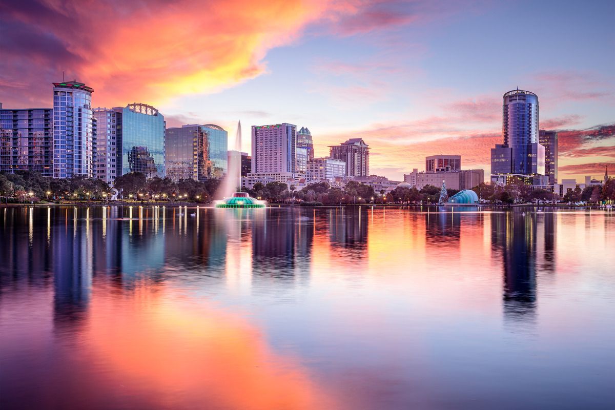 city skyline behind body of water