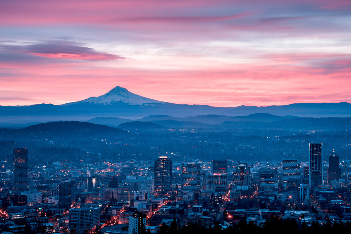 portland city skyline at sunset with mountain in background
