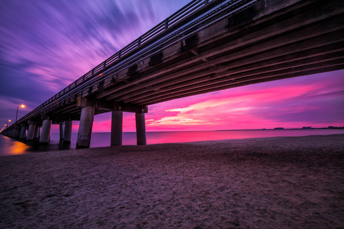 an elevated roadway extends out over a body of water