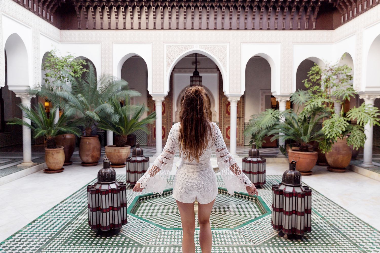 View of Marrakech's bustling market square with vibrant shops and traditional architecture