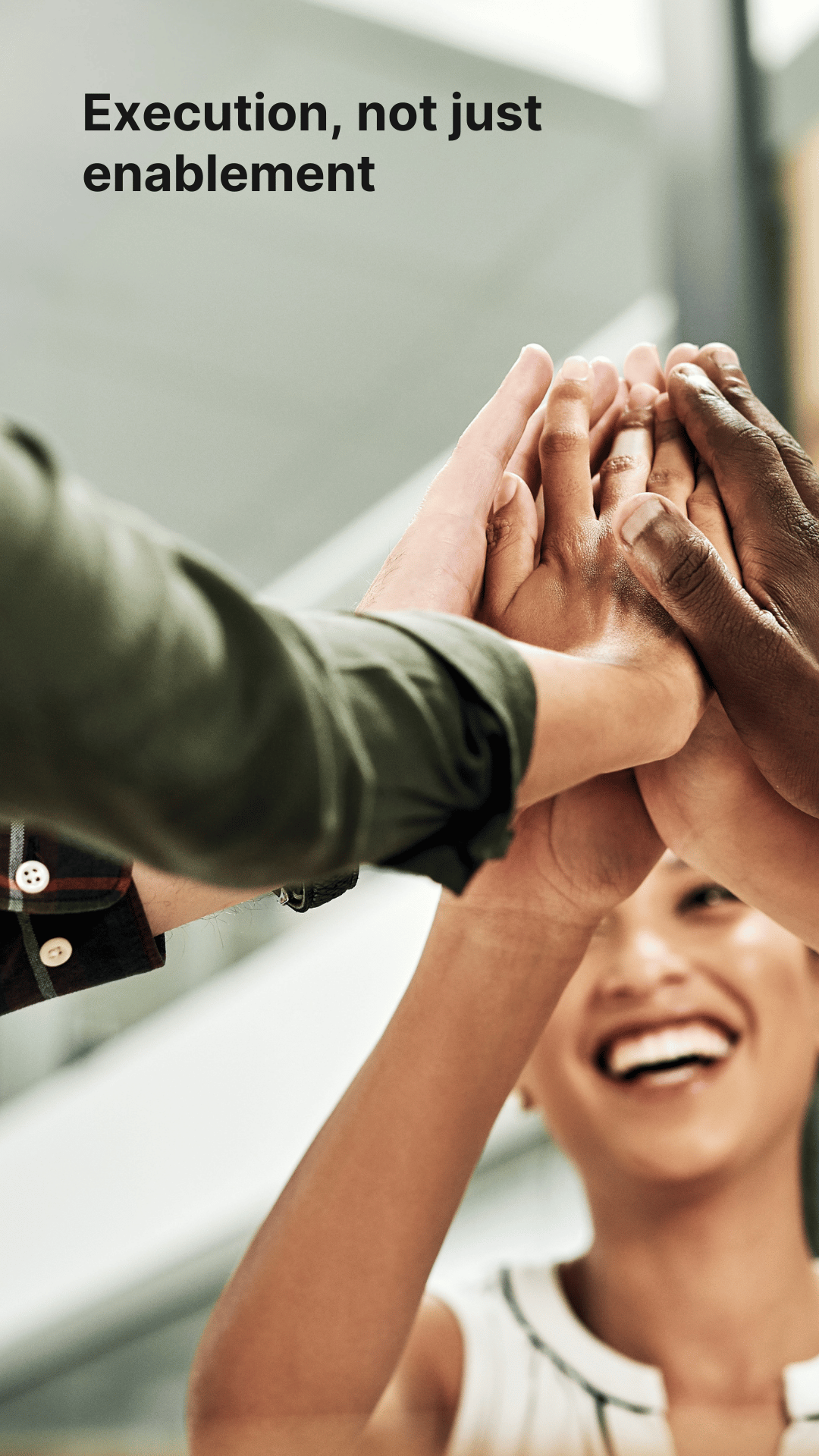Teammates high-fiving — celebrating alignment and action, not just enablement.