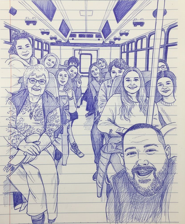 A blue ink drawing on lined paper showing a group of people smiling and interacting inside a bus or train carriage.