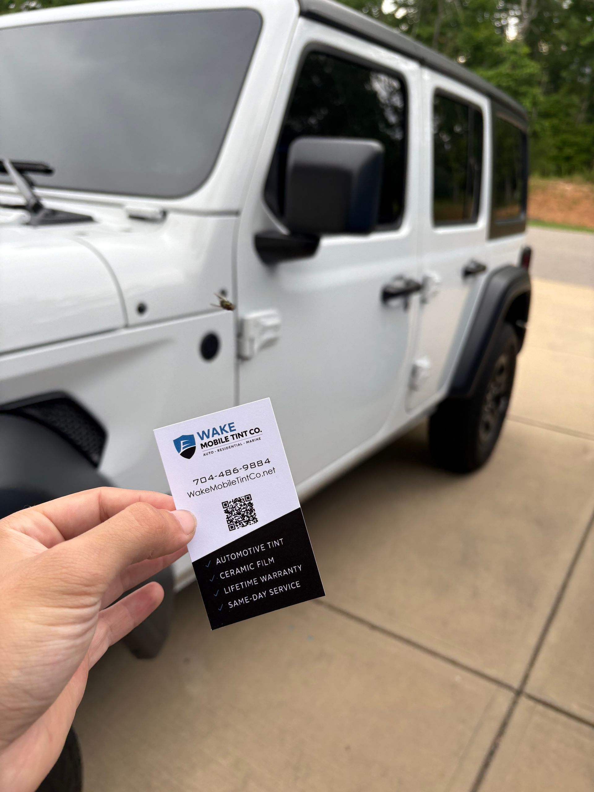 Black SUV with professional mobile window tint installation in Raleigh NC