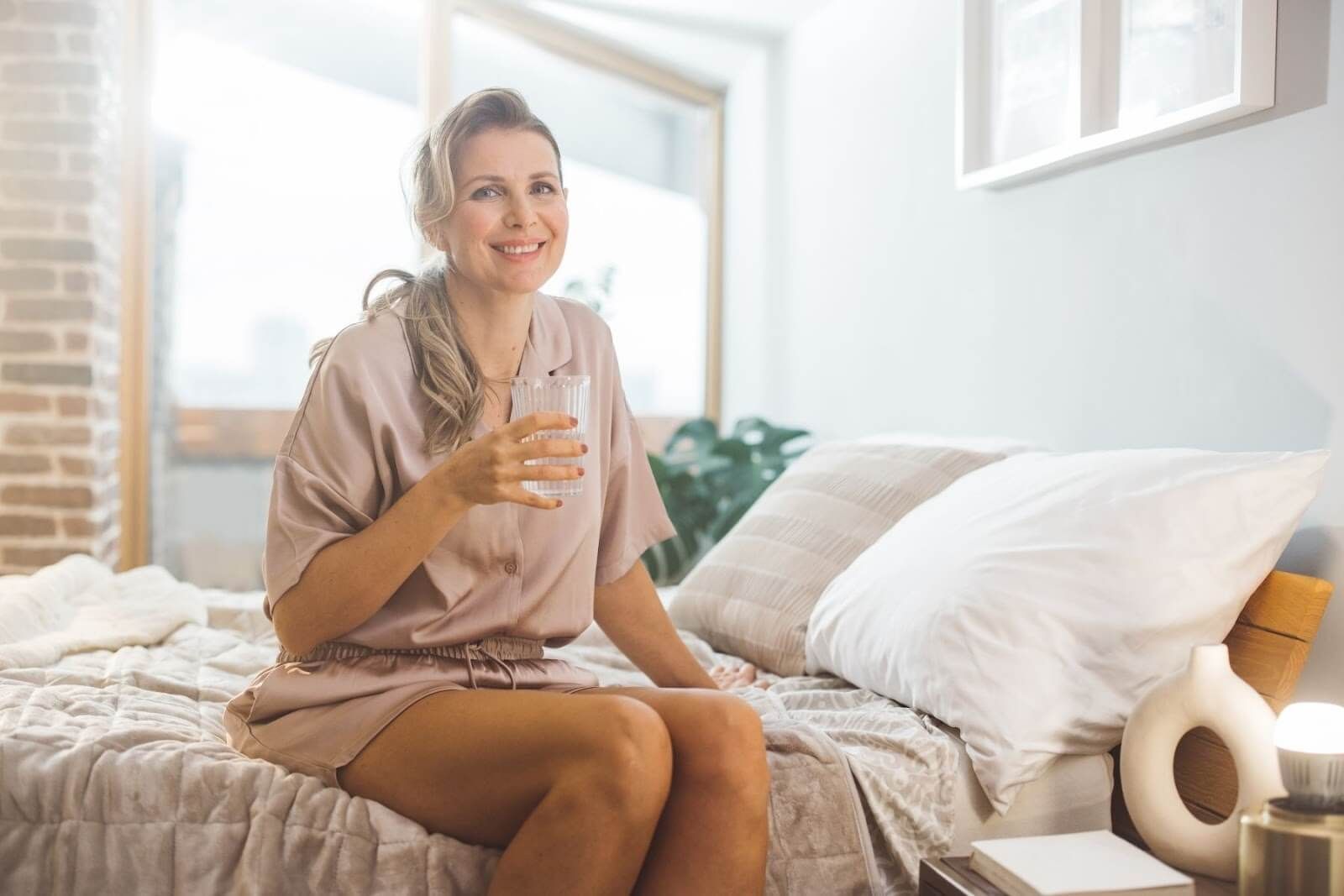 Smiling woman appears youthful and radiant thanks to the rejuvenating effects of peptide therapy