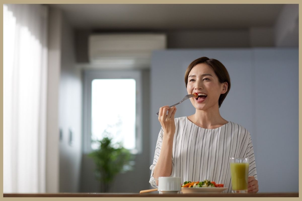 Woman eating healthy meal as part of her lifestyle