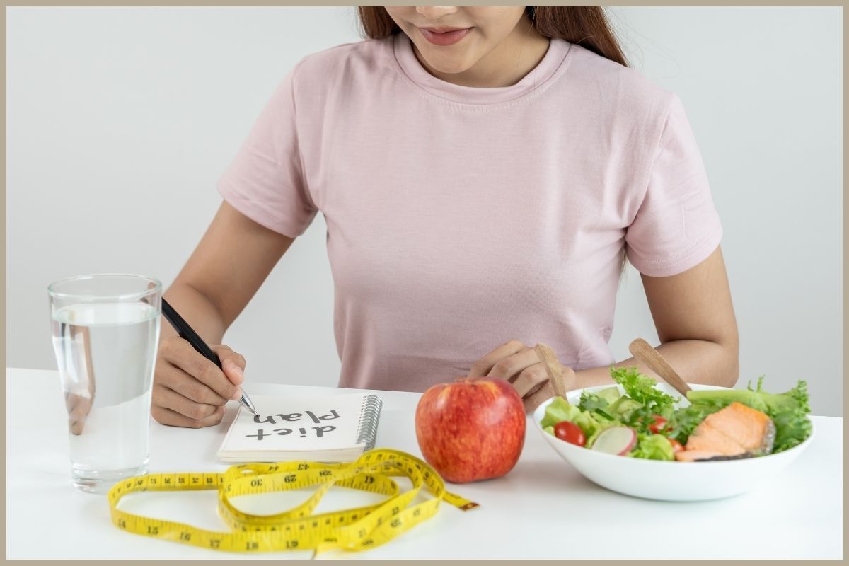 girl facing healthy food and a measuring tape