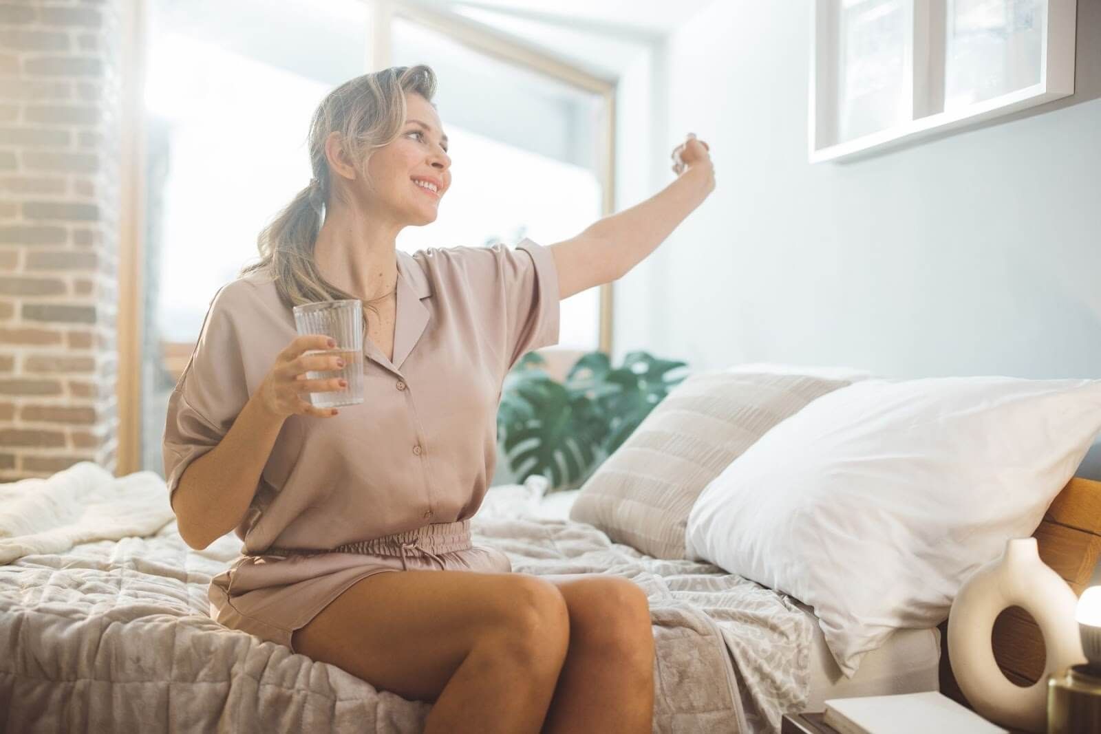 smiling woman embracing herself after having peptides