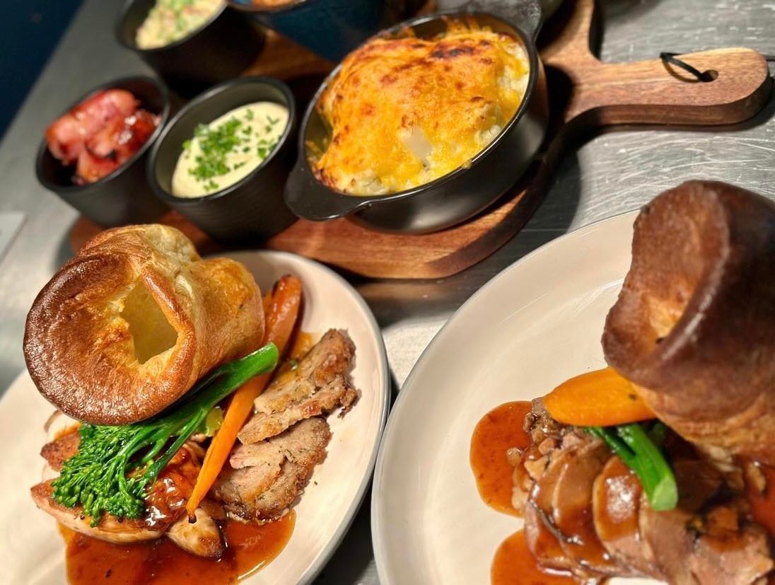 Sunday Lunch at the Boot & Shoe, Waterfoot, Rossendale, roast dinner: peas, roast potatoes, Yorkshire pudding and gravy.