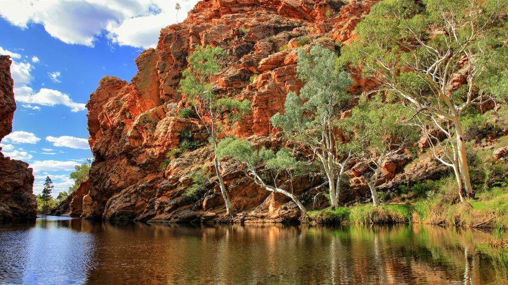 Red Rock Canyon Walls Border a Calm River — CKS Electrical and Air Conditioning in Alice Springs, NT