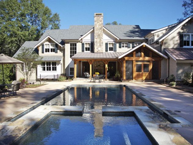Luxury home with pool and outdoor seating area.