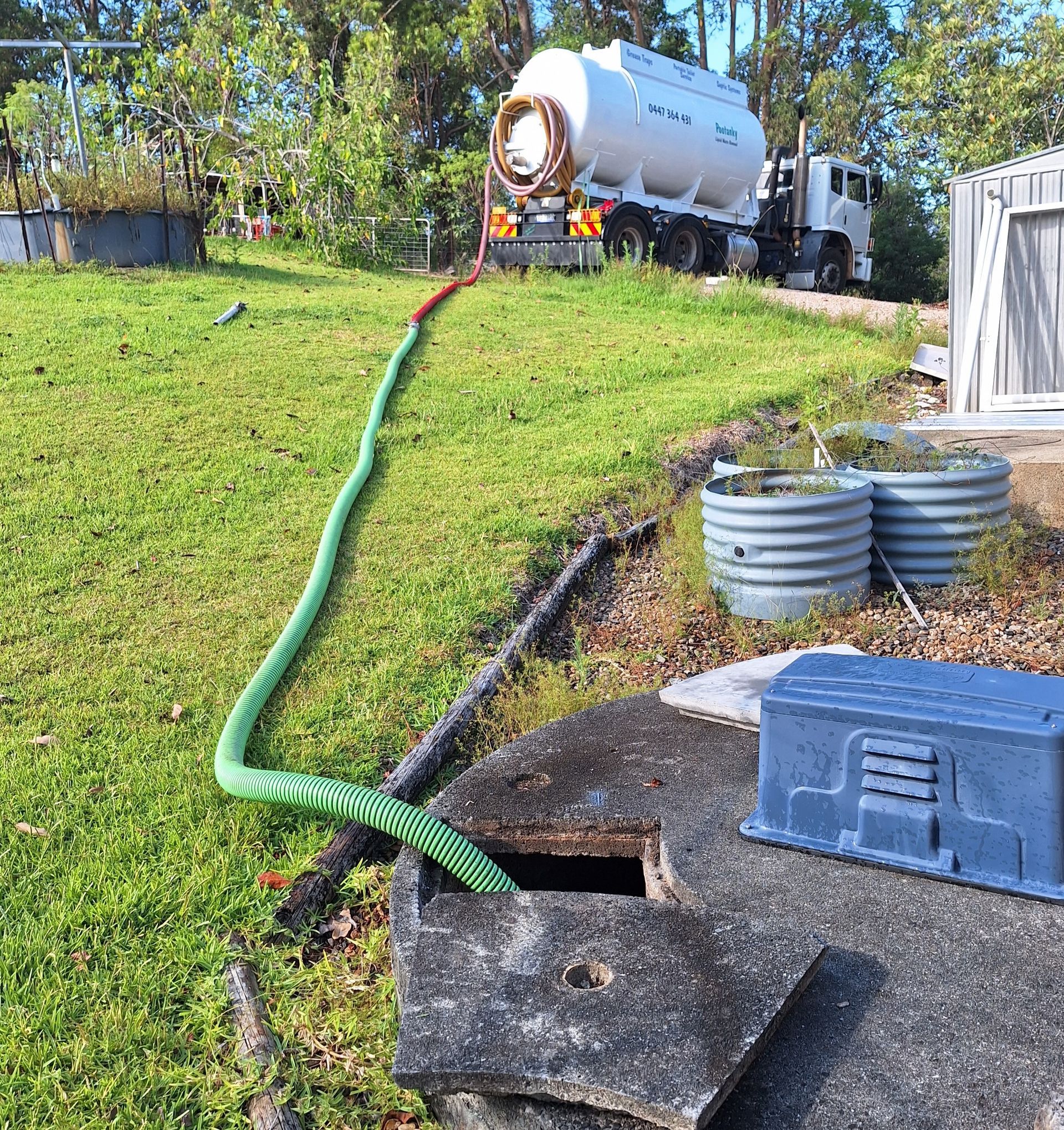 A Septic Tank Is Sitting In The Middle Of A Lush Green Yard — Pootanky Lismore, NSW