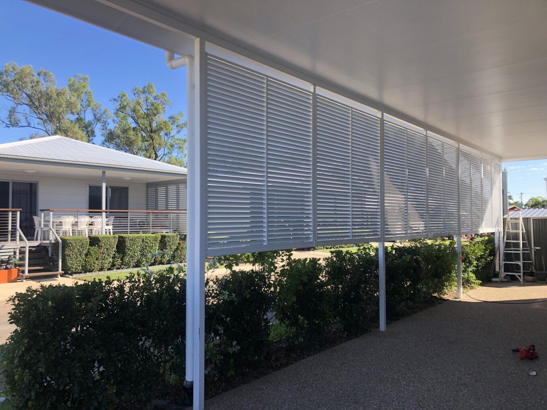 White Slatted Screens Provide Shade Under a Carport — Lifestyle Aluminium Lattice in West End, QLD