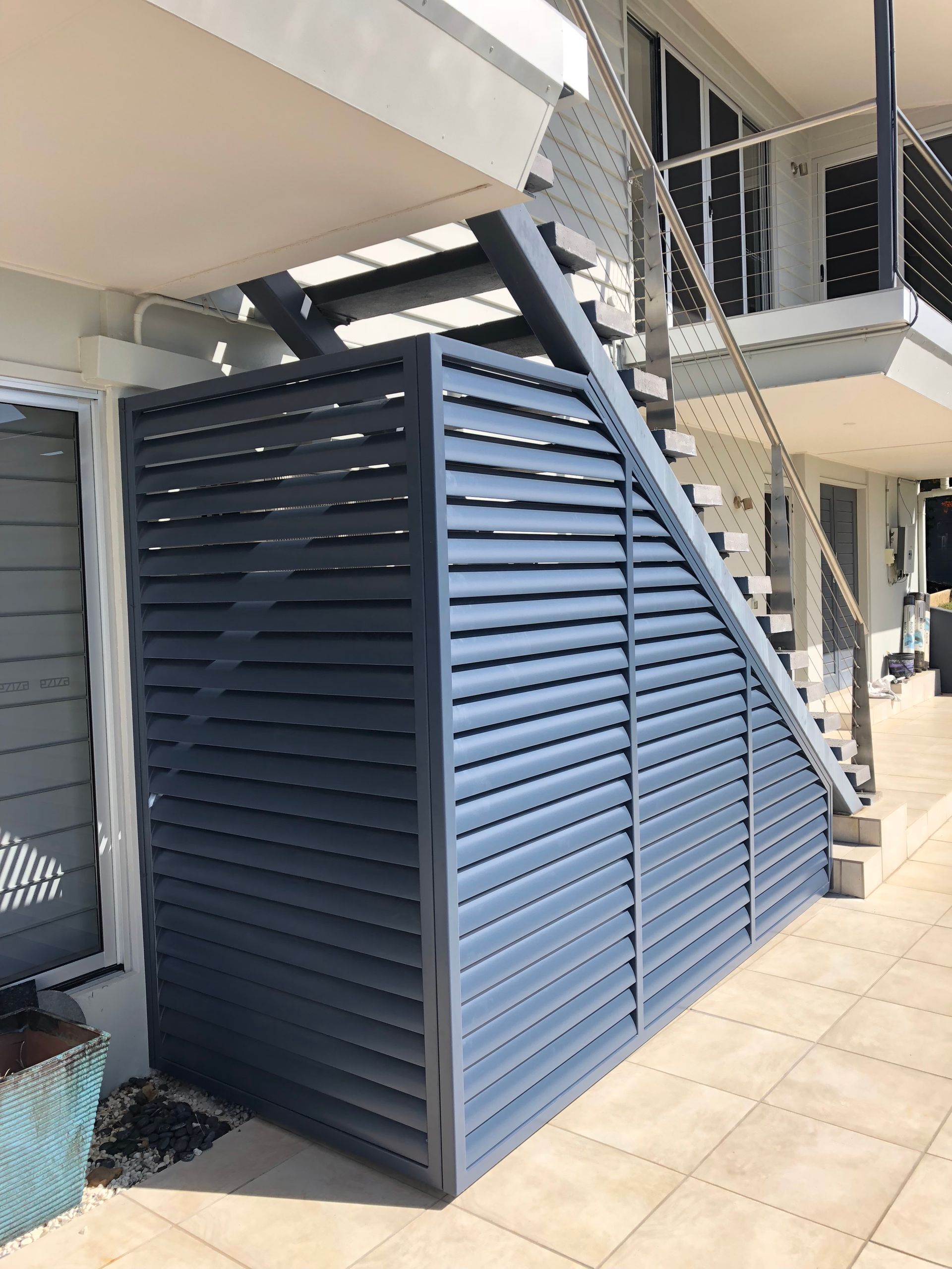 Blue-gray Slatted Screen Beneath Exterior Stairs, on a Patio — Lifestyle Aluminium Lattice in Annandale, QLD