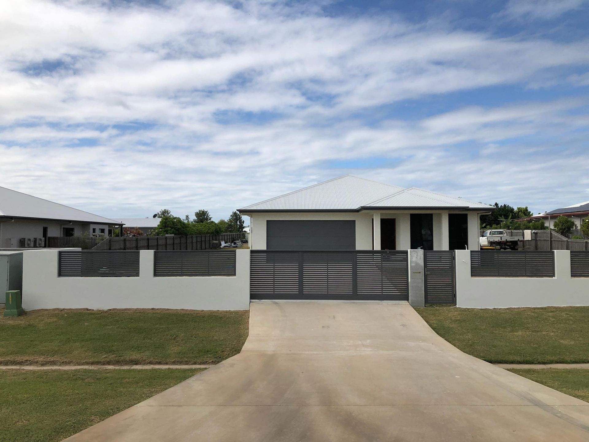 House With Grey Garage Door — Lifestyle Aluminium Lattice in West End, QLD
