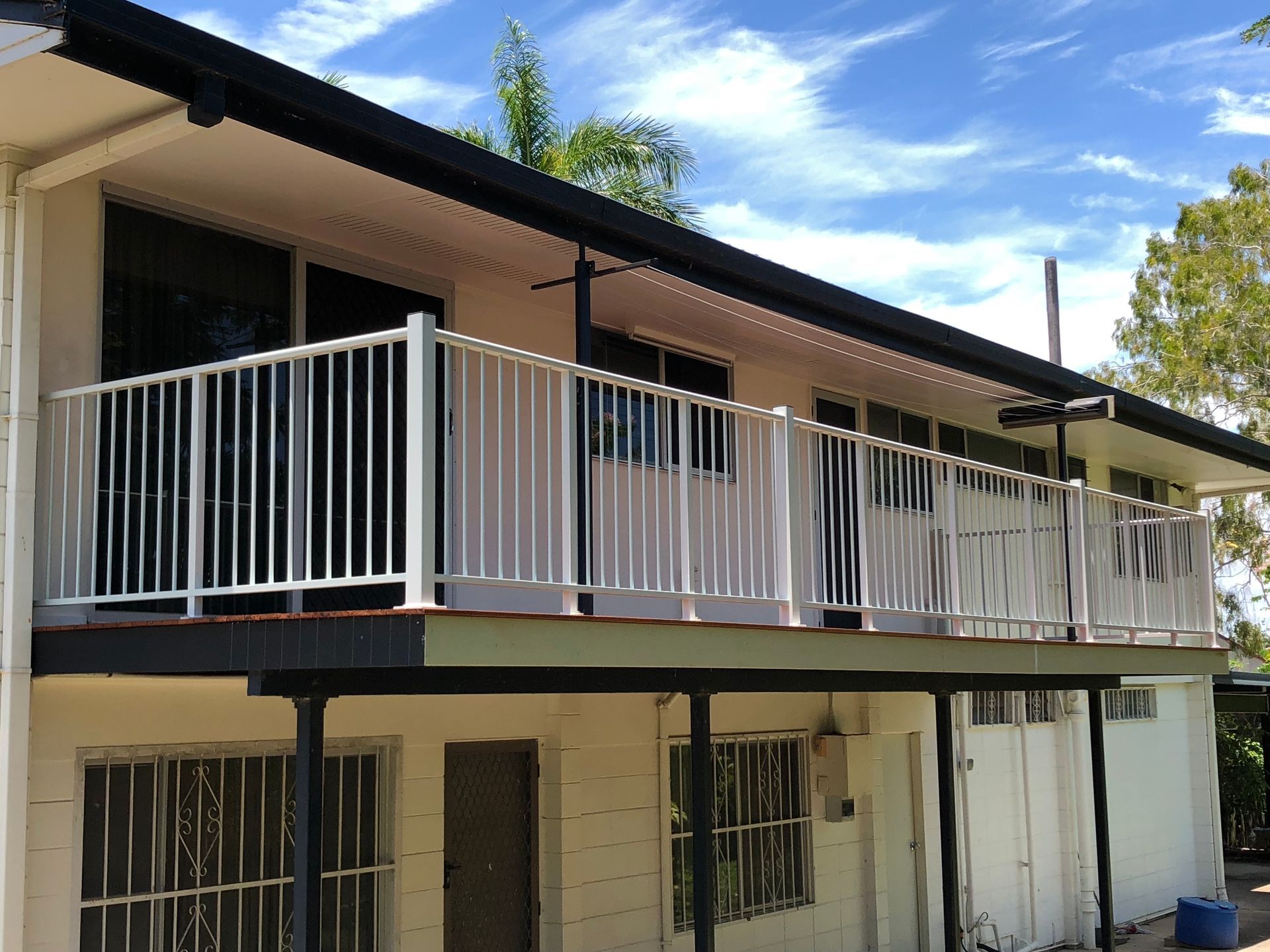 Two-story House With White Railings on a Balcony — Lifestyle Aluminium Lattice in Mount Louisa, QLD