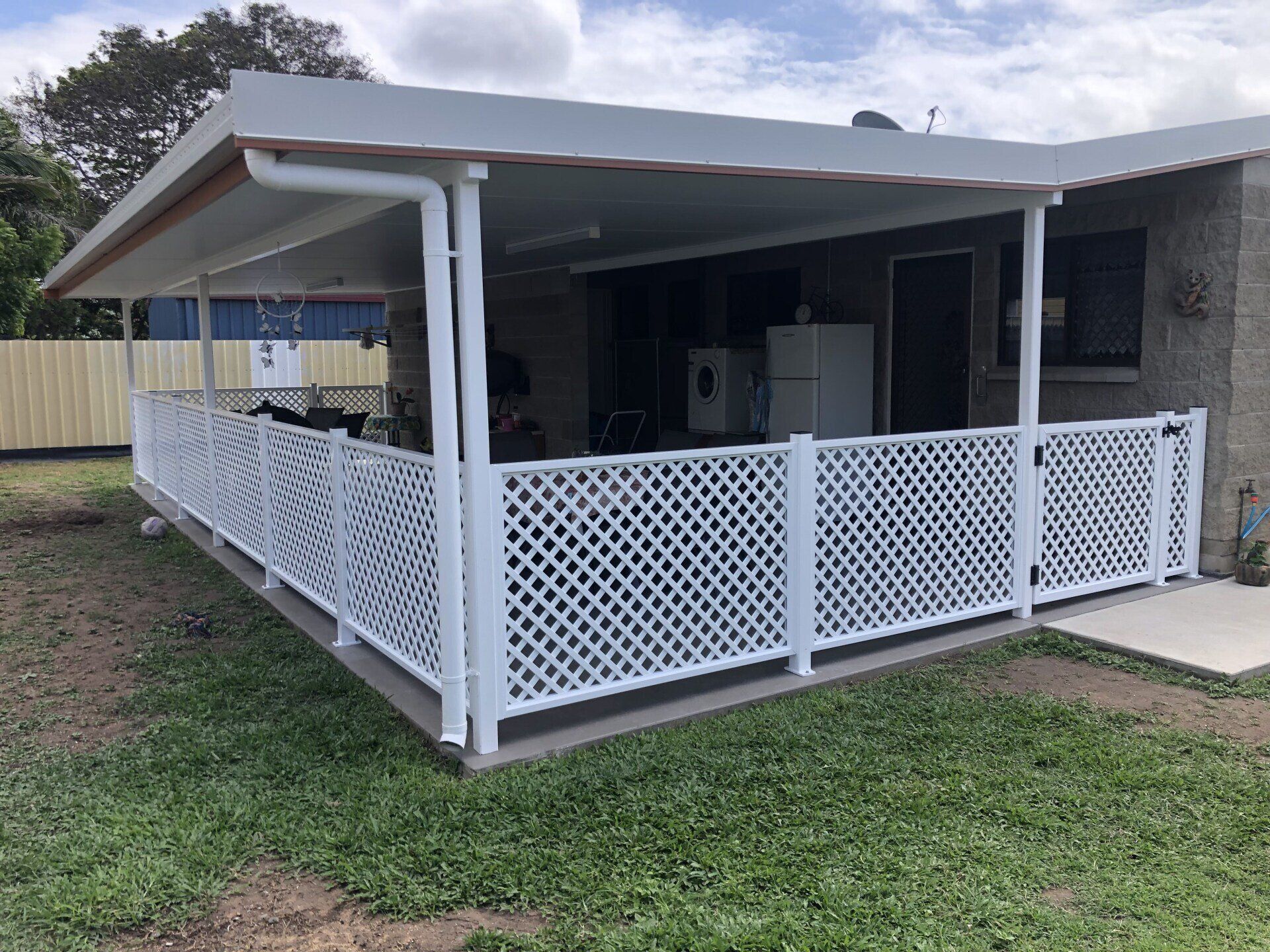 White Lattice Fence Surrounds a Covered Patio — Lifestyle Aluminium Lattice in West End, QLD