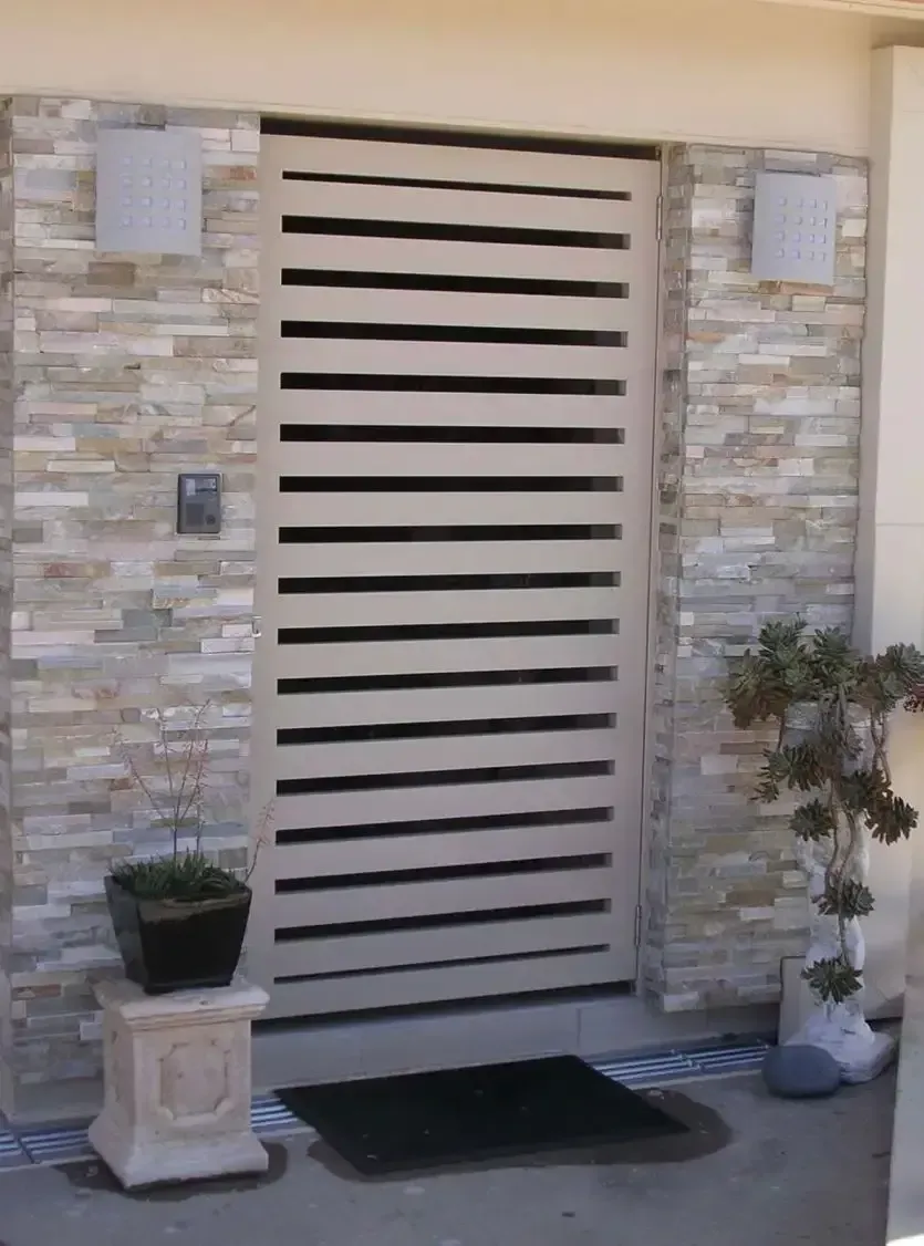 Beige Horizontal Slat Gate, Stone Wall, Two Sconces — Lifestyle Aluminium Lattice in Annandale, QLD