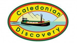 Caledonian Discovery logo: Green ship on blue water, mountains in background, yellow oval with text.