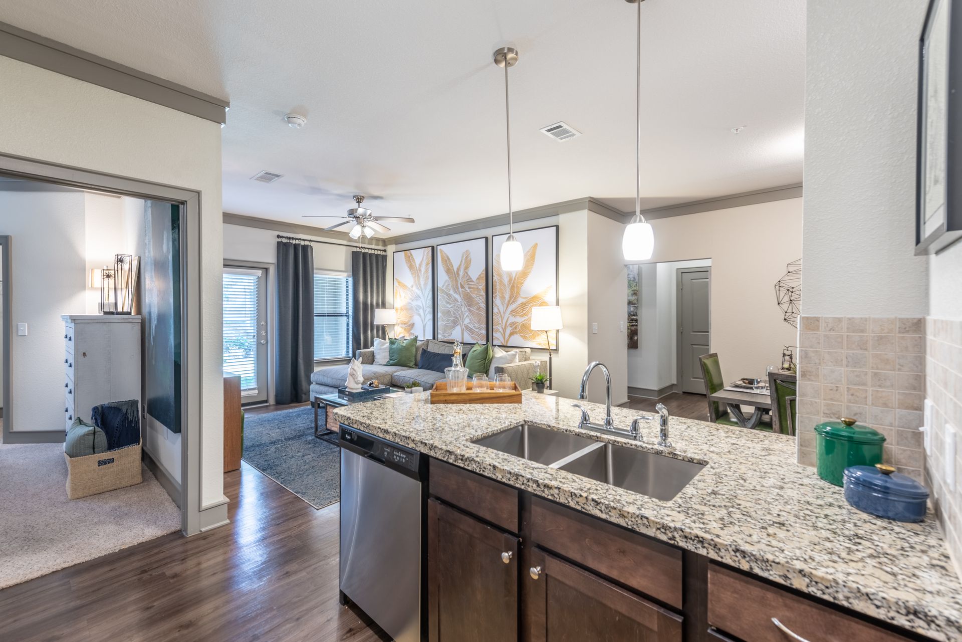 A kitchen with granite counter tops and stainless steel appliances at Marquis Seven Lakes offers Cinco Ranch apartments for rent.