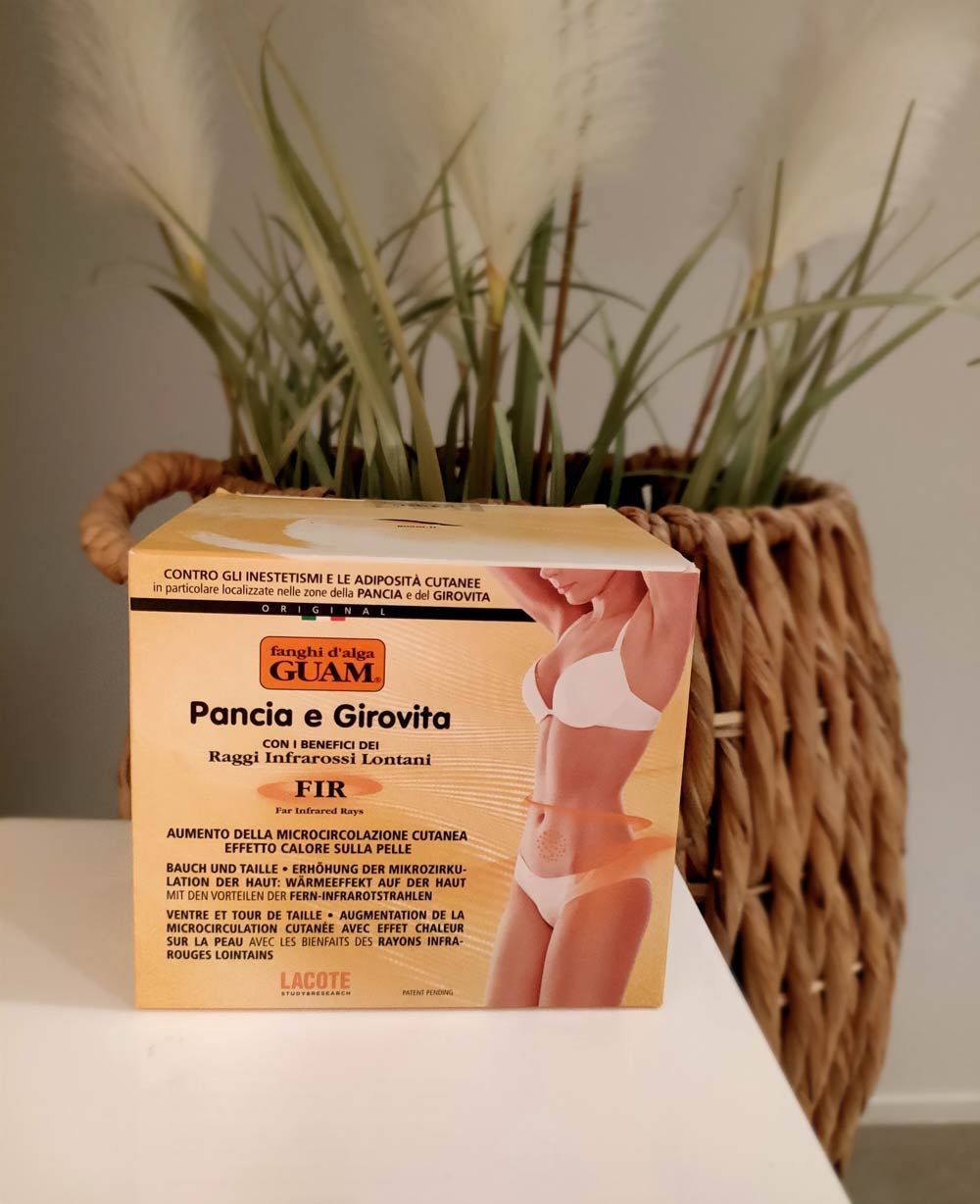 Tummy and waist mud box on a table in front of a plant