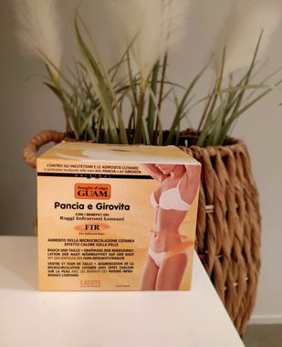 Tummy and waist mud box on a table in front of a plant