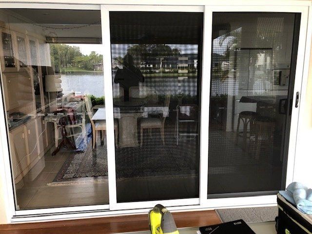 New glass sliding doors with stainless steel sliding security doors