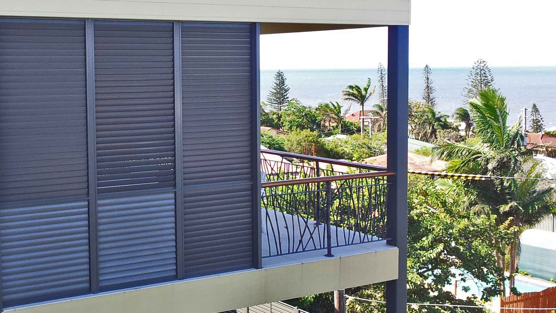 Image of aluminium shutters on edge of balcony