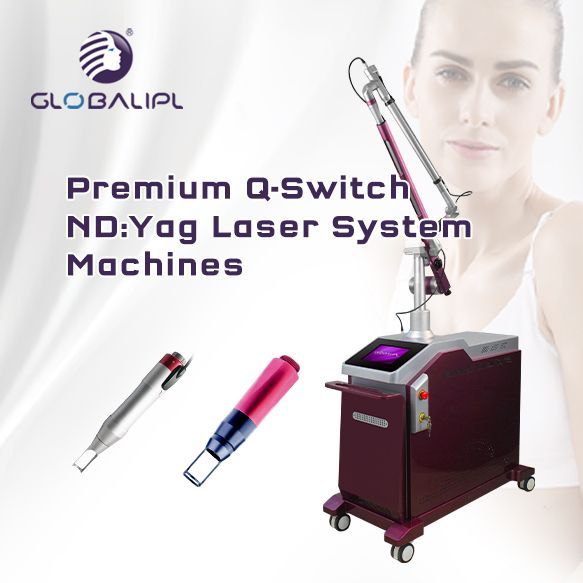 A woman is standing next to a machine that says premium q-switch nd : yag laser system machines