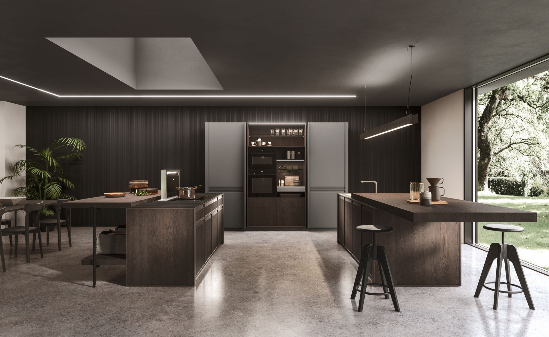 Cucina moderna con due isole, mobili in legno scuro, pareti grigie e una grande finestra con vista sul verde.