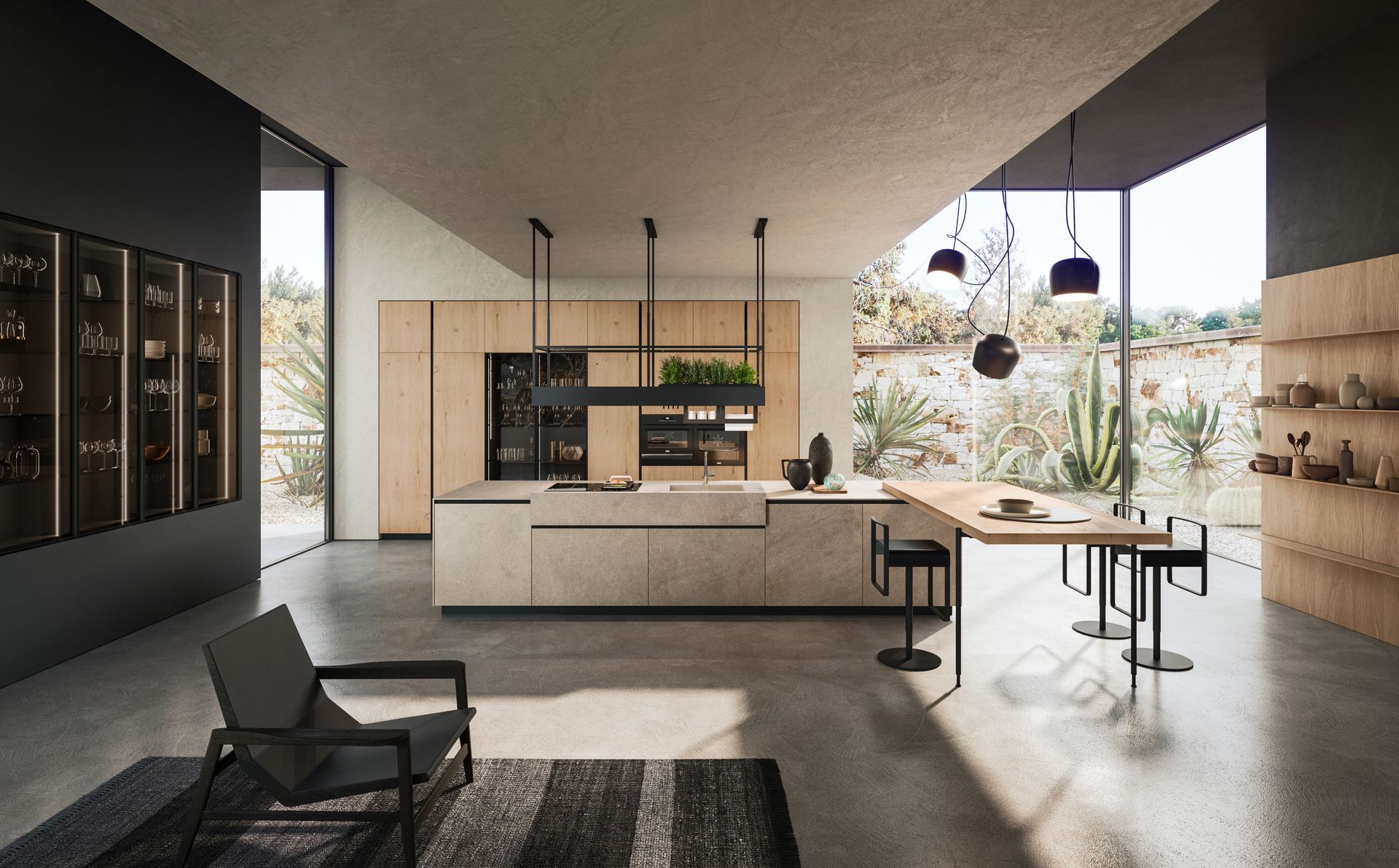 Cucina moderna con pavimenti in cemento, mobili in legno e ampie finestre. Include un tavolo da pranzo e una poltrona.