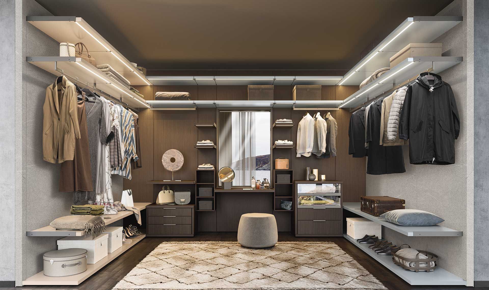 Cabina armadio con vestiti, ripiani e mobiletto per il trucco. Colori beige, marrone e grigio.