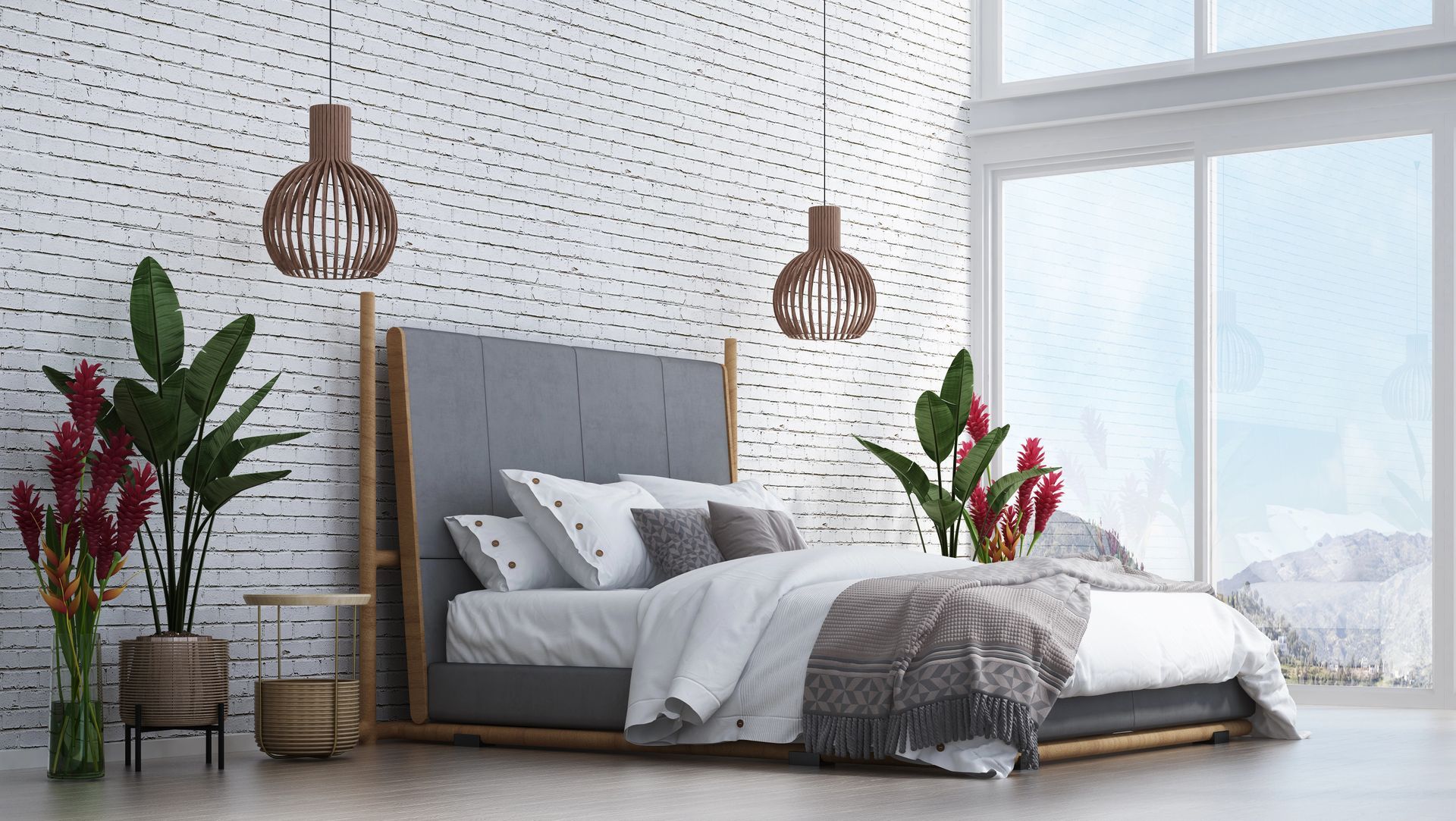 Camera da letto con letto grigio, struttura in legno, parete in mattoni bianchi, grande finestra, piante.