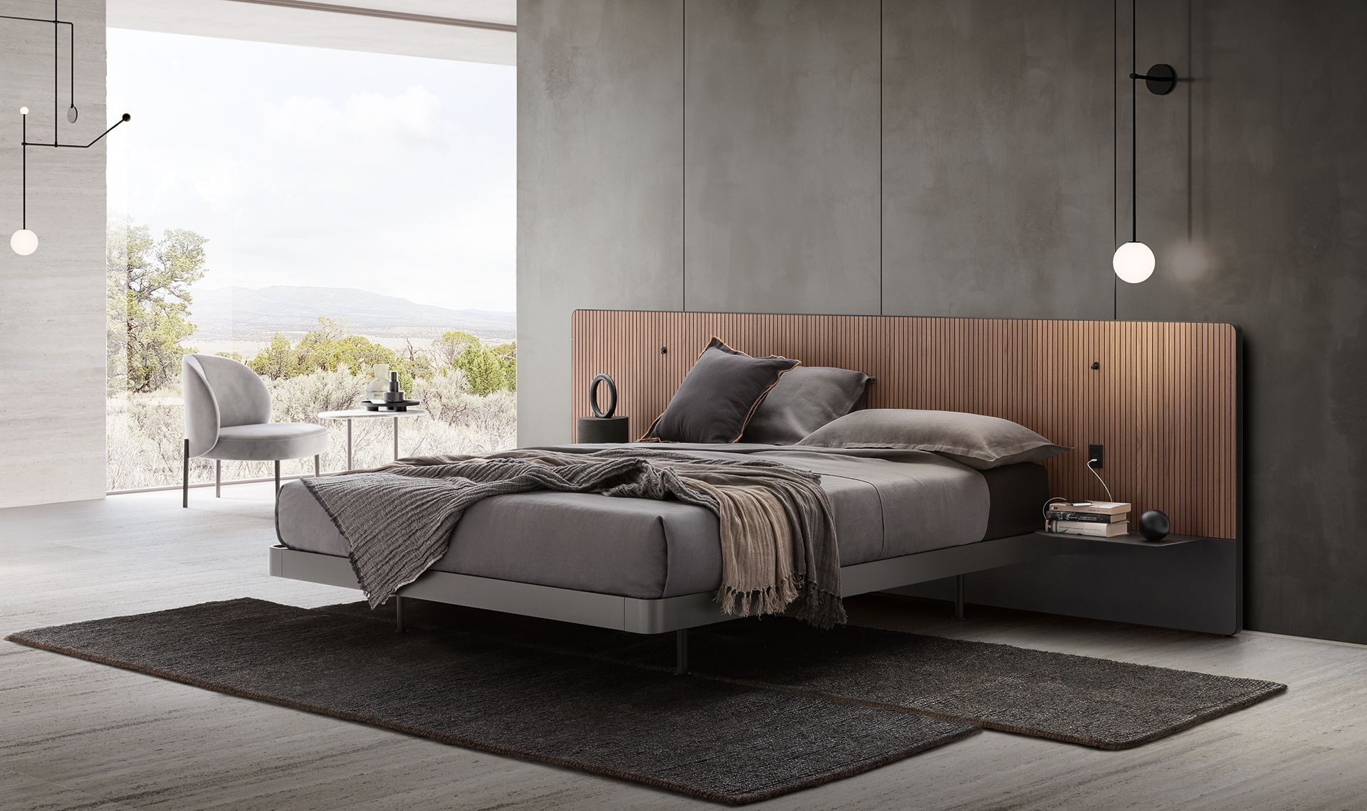 Camera da letto moderna con letto grigio, testiera in legno, tappeto scuro e ampia finestra.