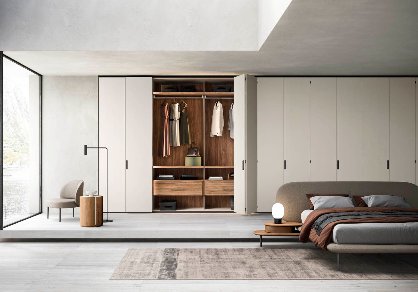 Camera da letto moderna con armadio in legno chiaro, letto e arredamento minimalista.