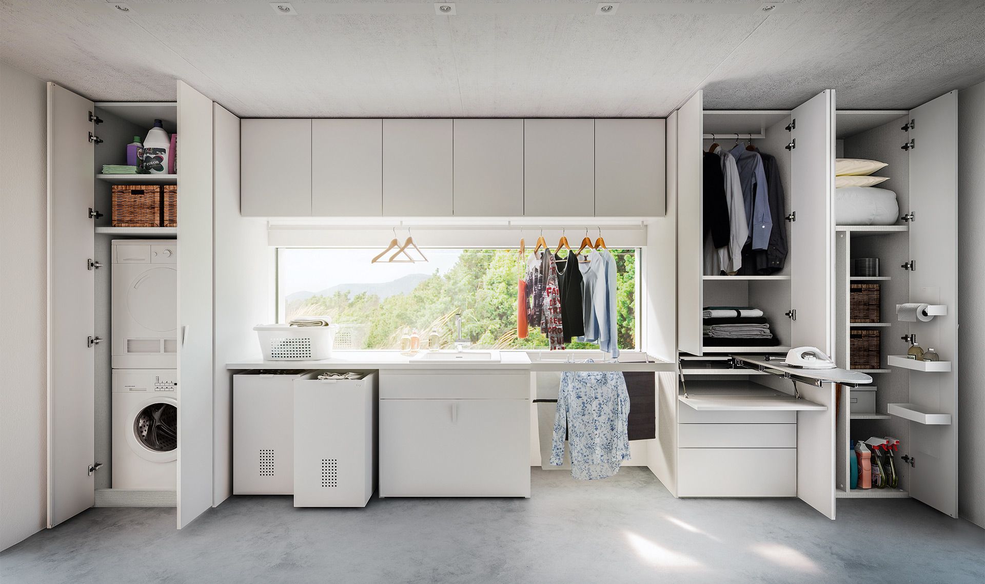Una moderna lavanderia bianca con armadi a vista, lavatrice, asciugatrice, asse da stiro e una finestra con i panni appesi.