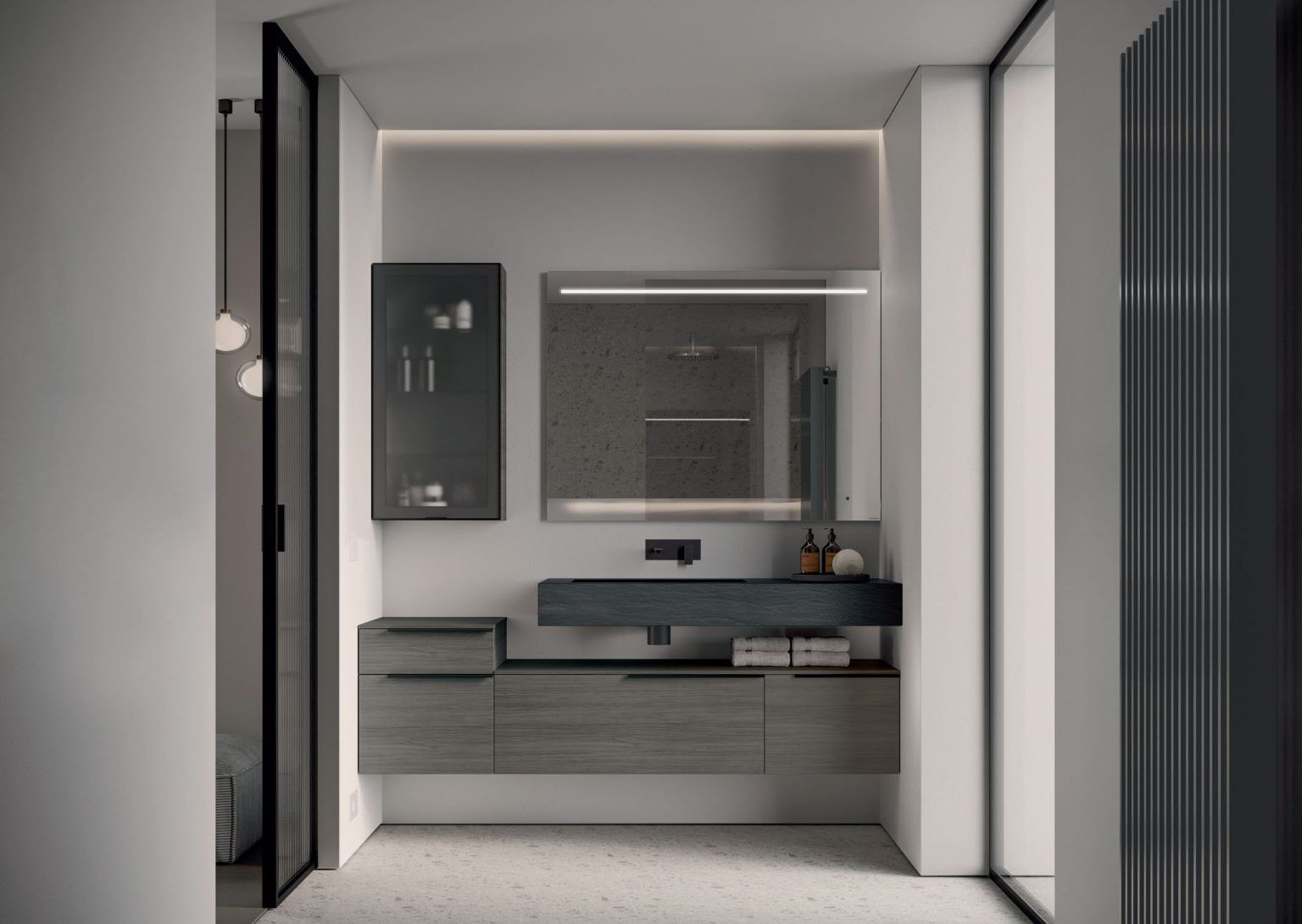 Bagno moderno con mobile lavabo grigio e legno, specchio con cornice nera e illuminazione integrata.