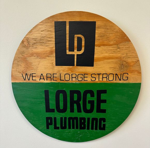 A sign that says we are lore strong lorge plumbing