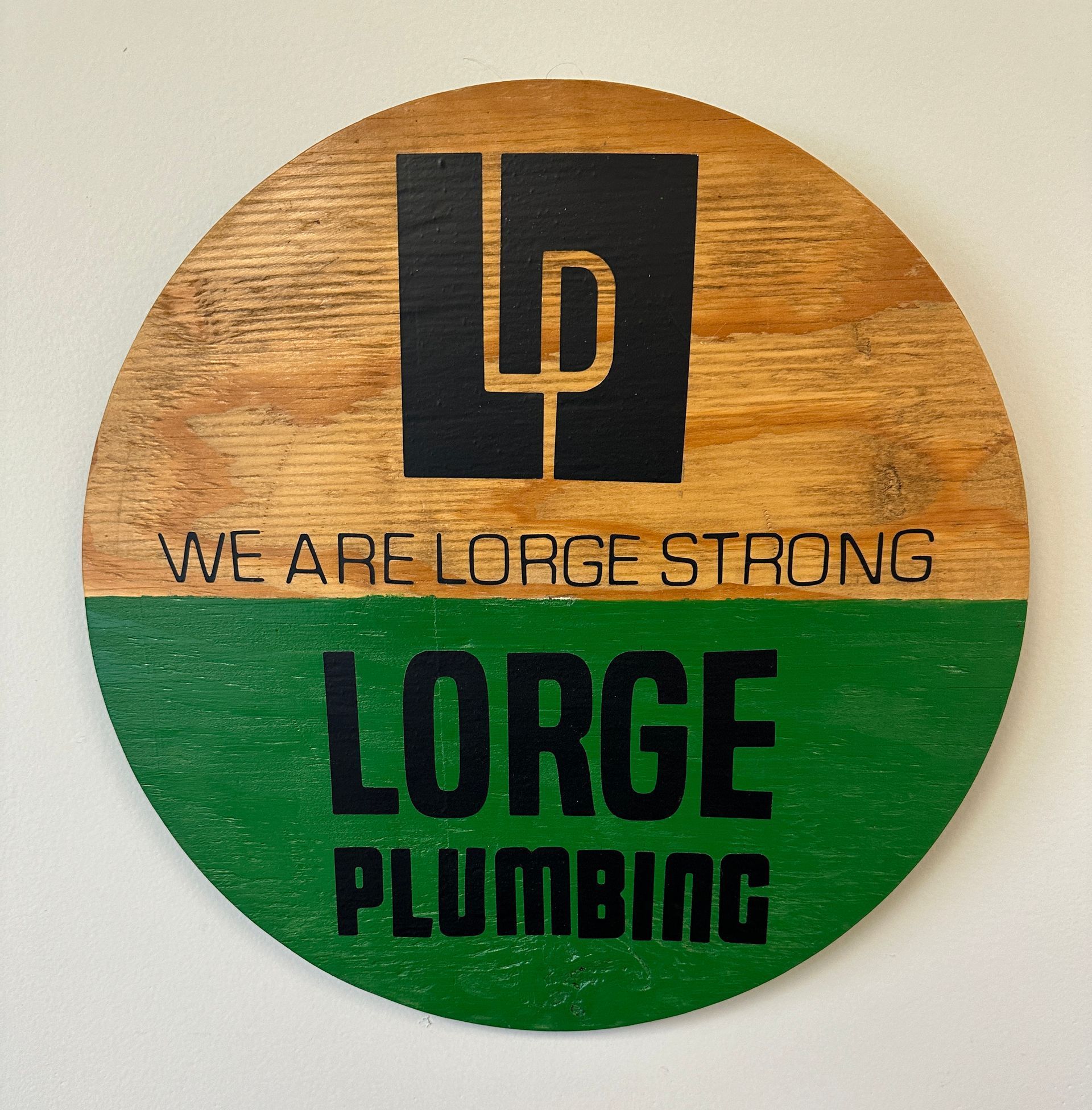 A sign that says we are lorge strong lorge plumbing